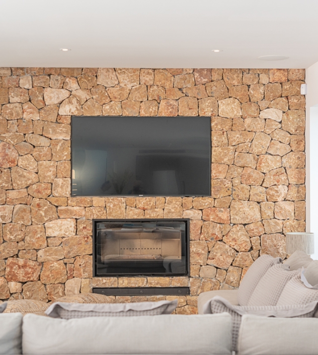 Resa estate modern villa for sale ibiza first line north stone wall.jpg